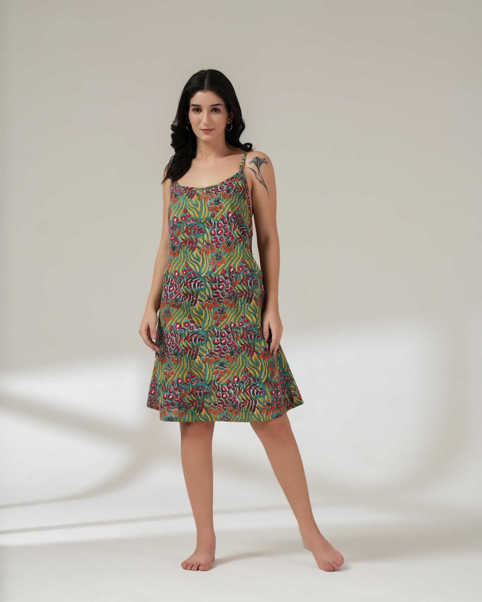 Woman wearing a colorful patterned dress on a white background