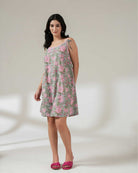 Woman wearing a floral dress on a white background